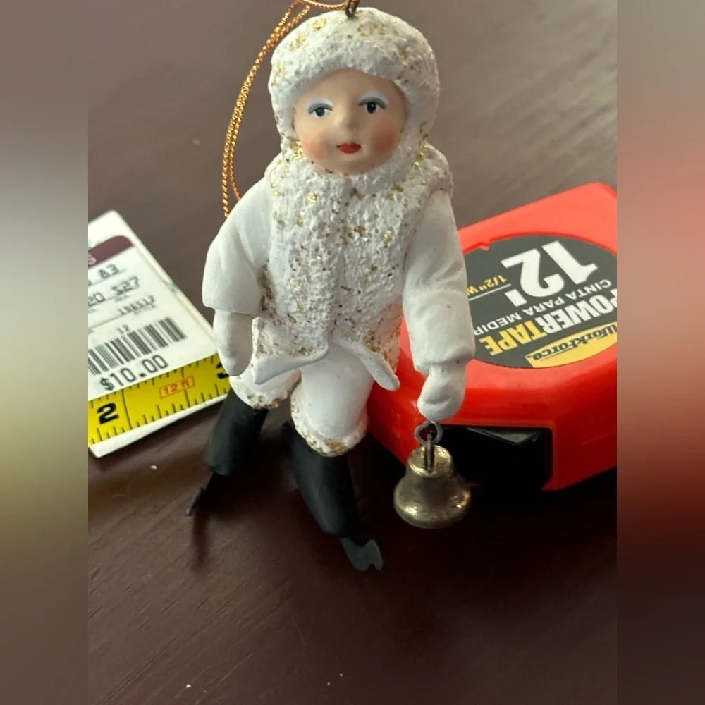 Vintage Department 56 White and Black “Belsnickle” ornament with ringing bell.